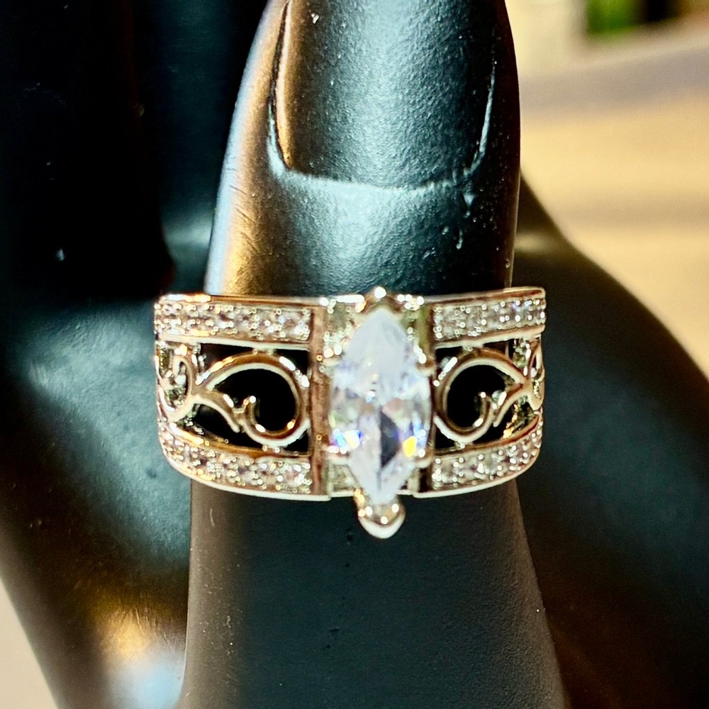 Marquise Cut Solitaire Cubic Zirconia with Channeled, Round Cut Cubic Zirconia
